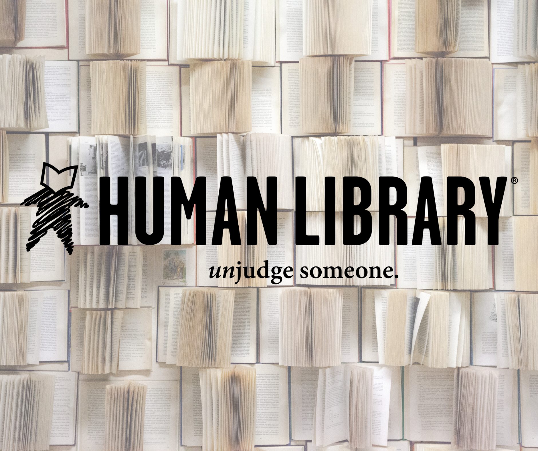 Human library logo over book page background