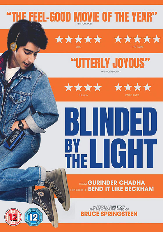 Movie poster for Blinded by the Light featuring Viveik Kalra in denim against an orange and white striped background.