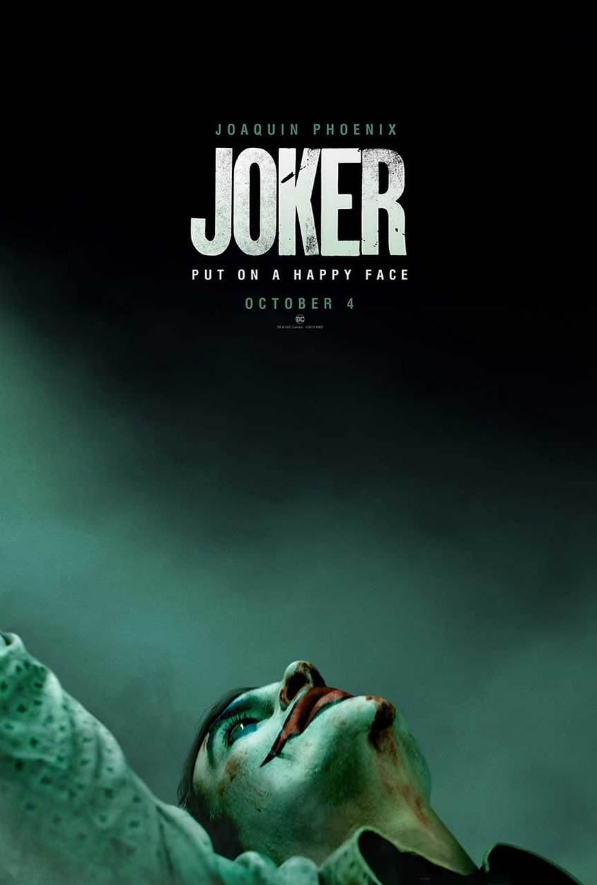 A poster for The Joker featuring Joaquin Phoenix in clown makeup with a dark green filter.