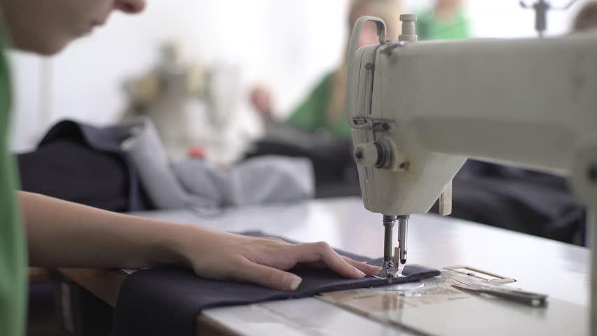 Image of a person using a sewing machine