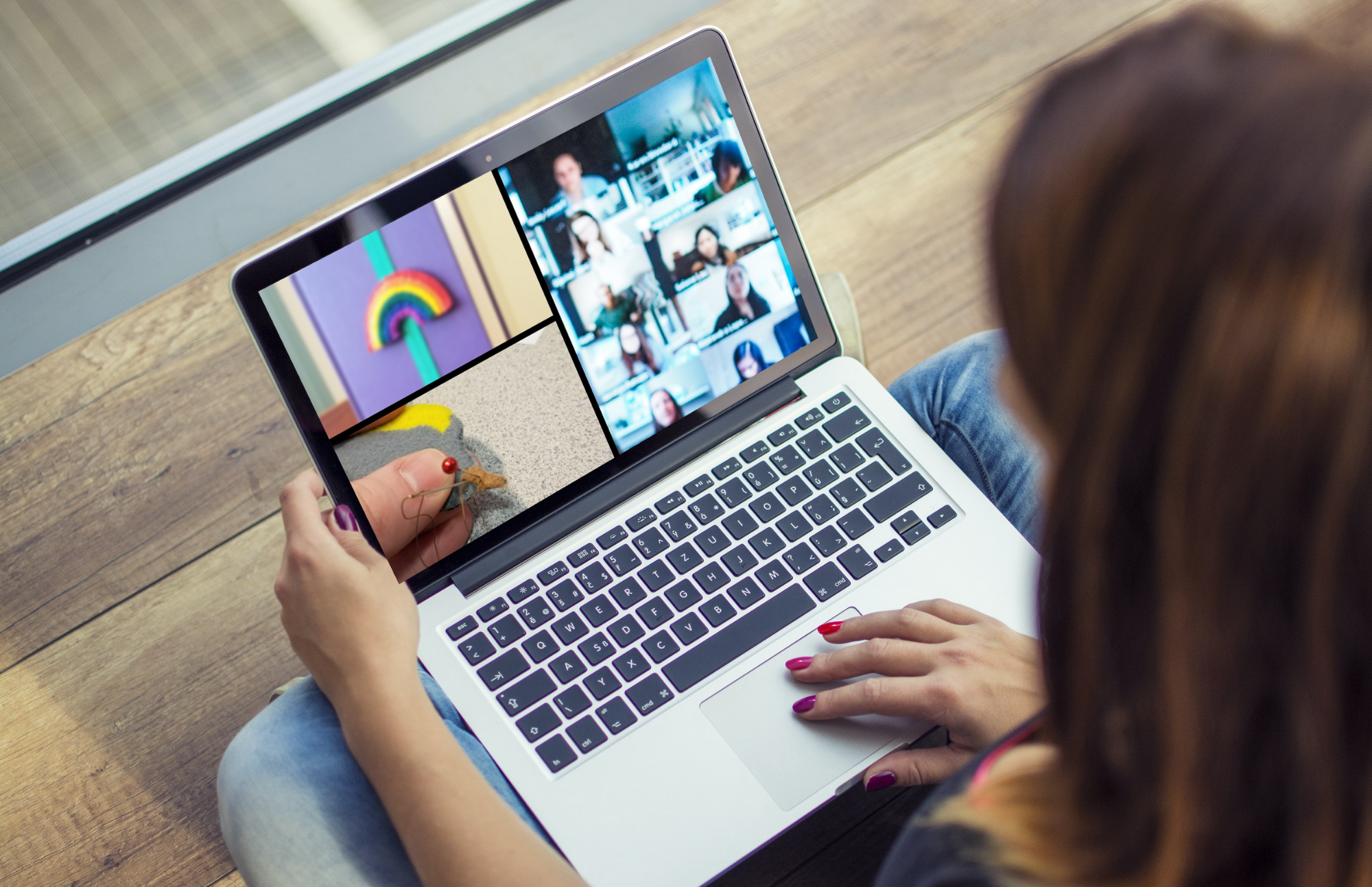 An open laptop displaying a video conference screen that shows call participants and pictures of the rainbow bookmark craft