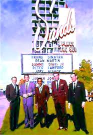 Photo of the five men of the rat pack standing in front of a sign in Las Vegas
