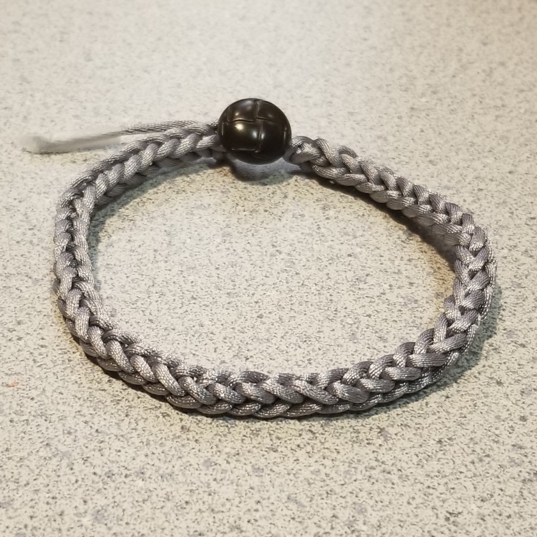 a gray, square braided bracelet