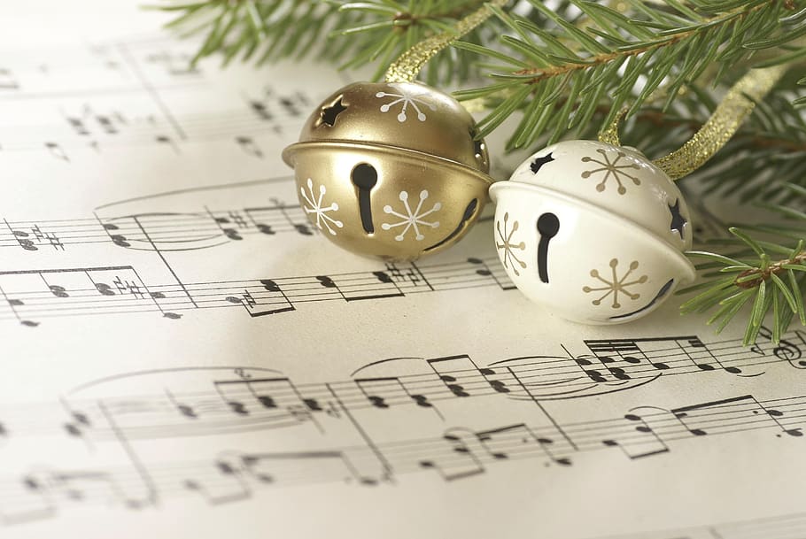 Image of jingle bells over sheet music
