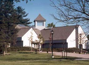 A picture of the Kellogg Environmental Center building, white with a gray roof