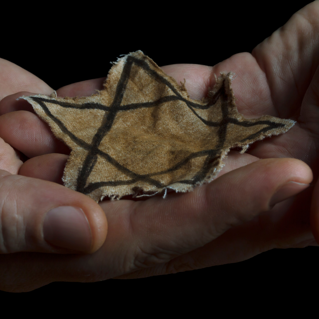 Image of hands holding Jewish Star