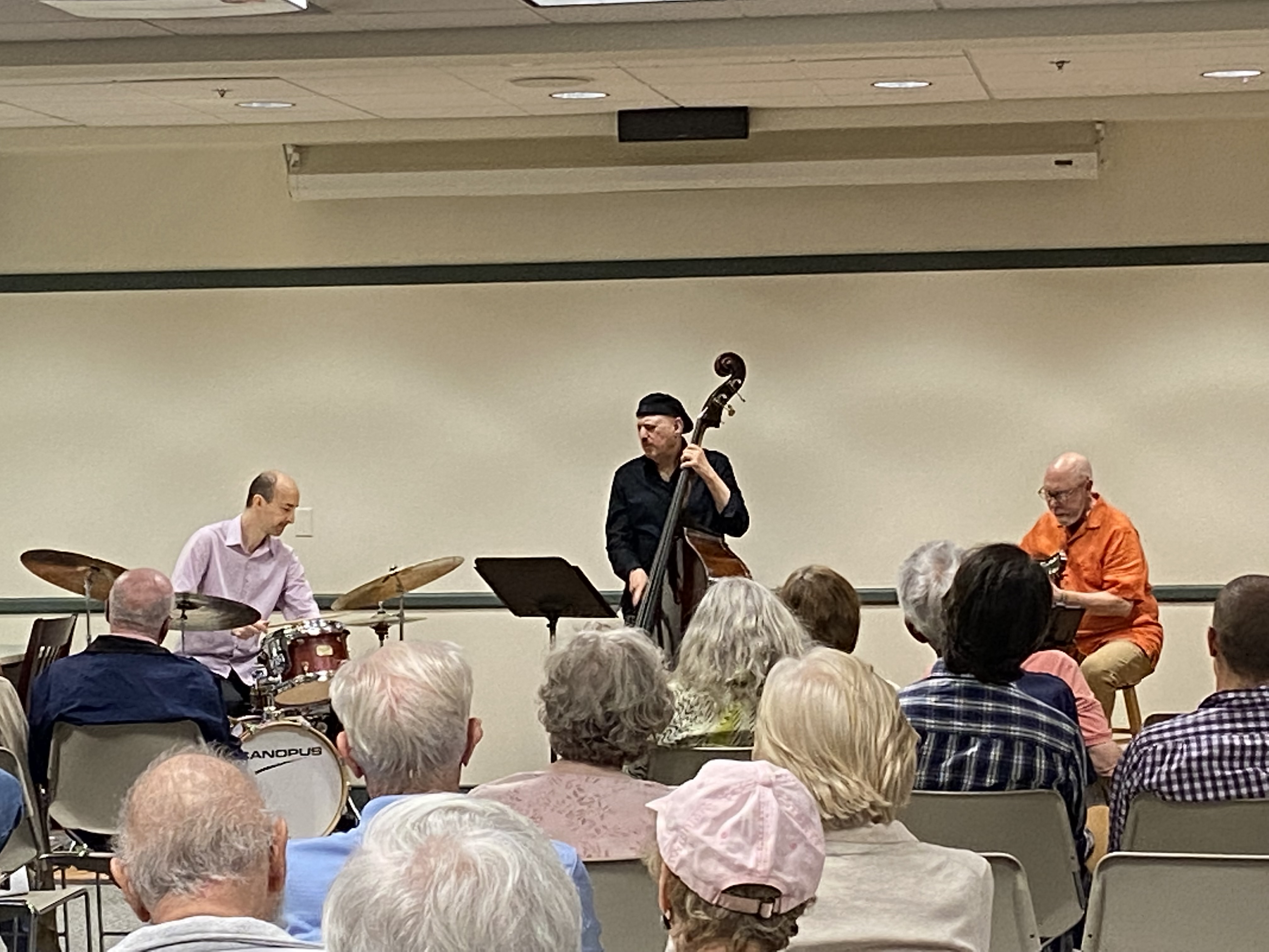 Image of three men playing instruments