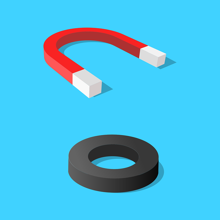 a blue background with a red horseshoe magnet and a black round magnet