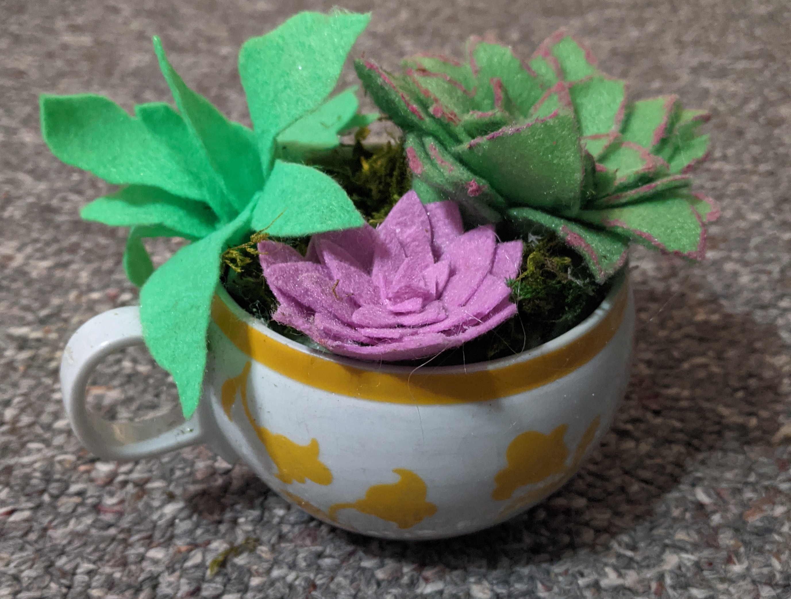 Image of a fabric succulent in a tea cup