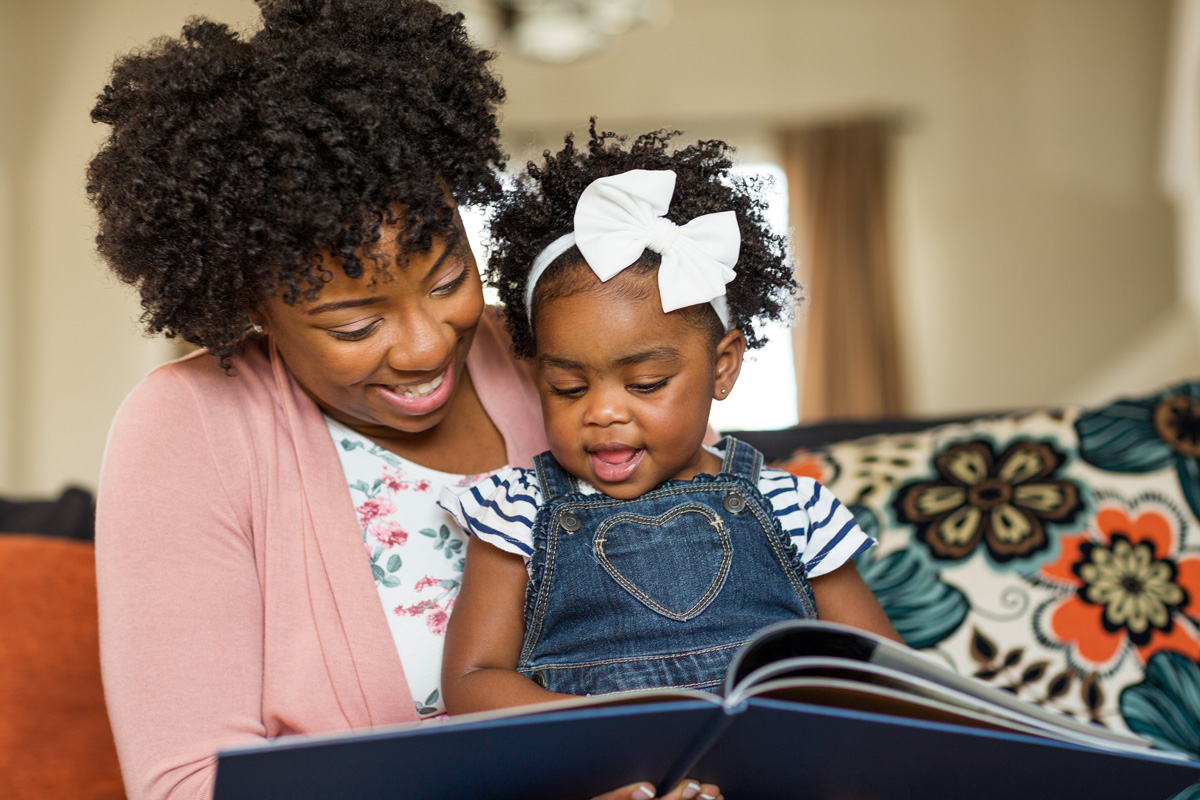Image of 'Mom and baby reading'