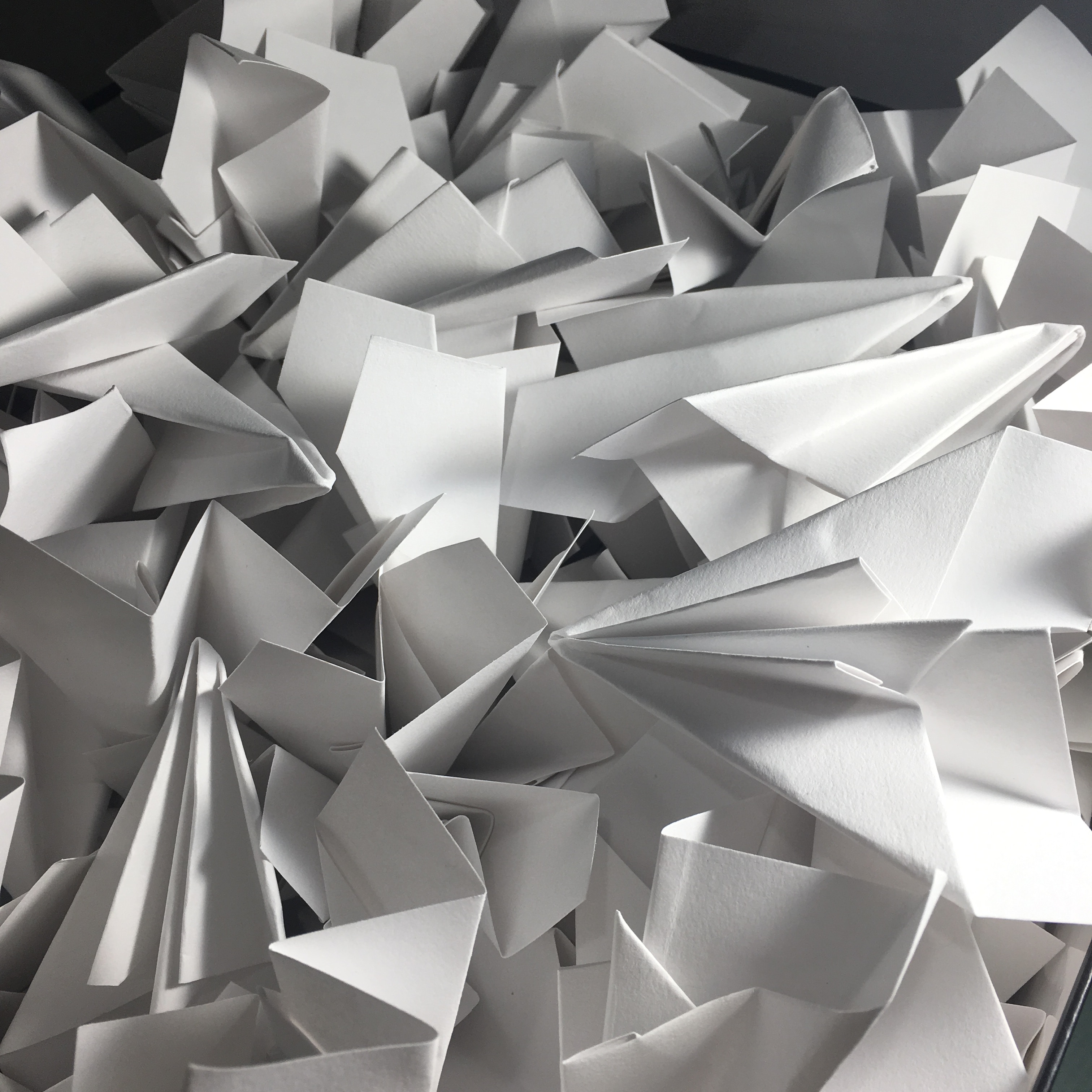 a pile of paper airplanes