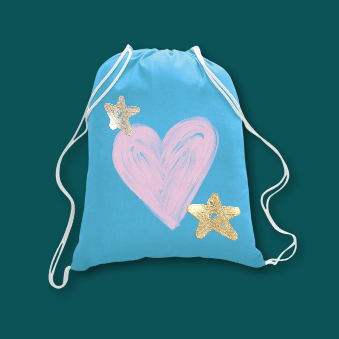 A blue canvas backpack with a heart and stars painted on it on a teal background