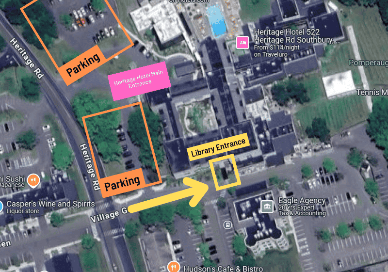 A map showing the library's entrance in Heritage Hotel. The library's entrance is outlined in yellow. Parking is outlined in orange. The Heritage Hotel's main entrance is indicated in pink.