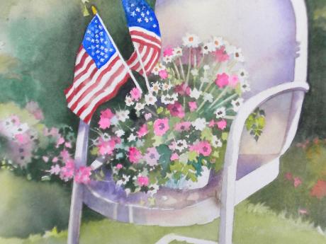 Image of flowers and flags on a chair
